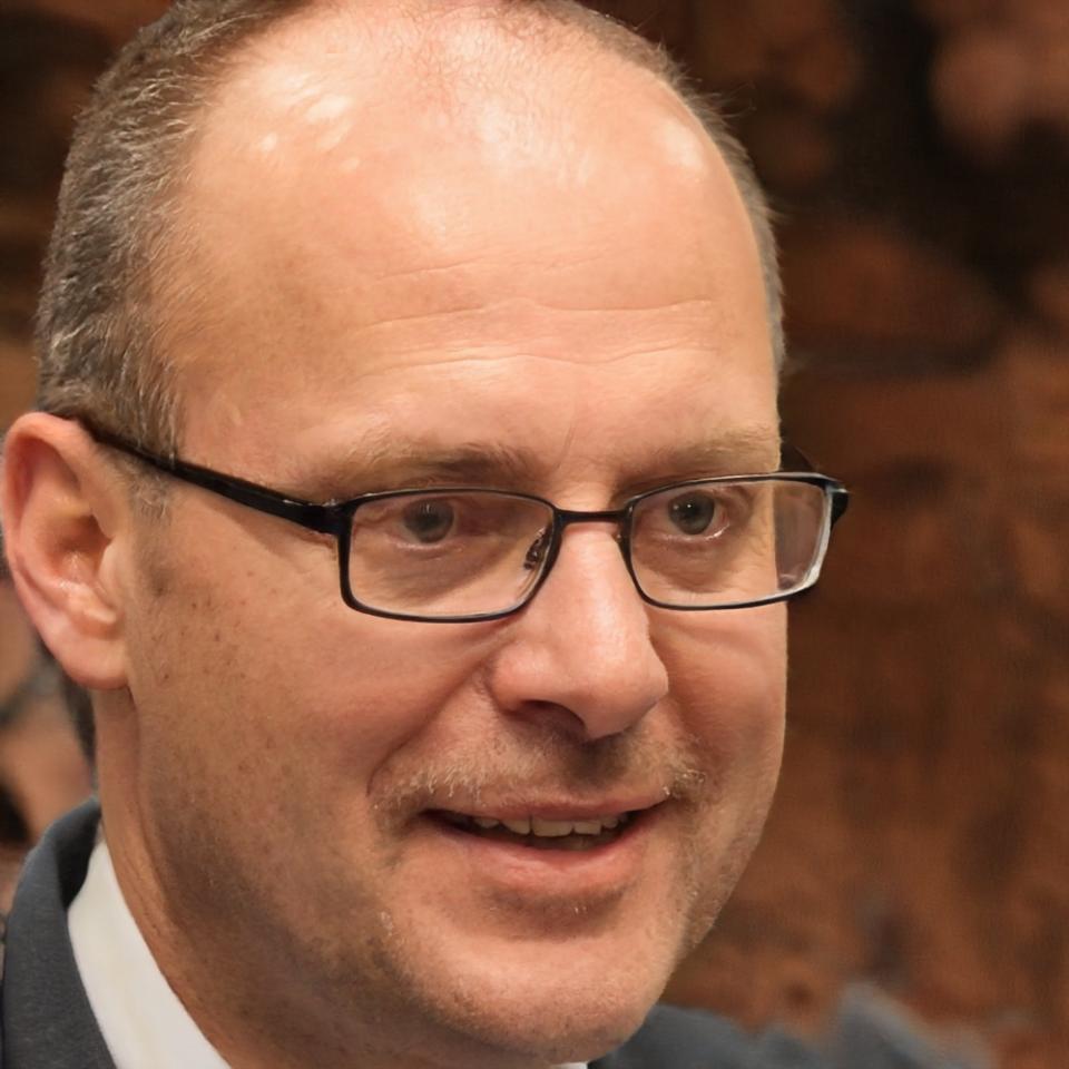 Professional team member reviewing financial documents and educational materials